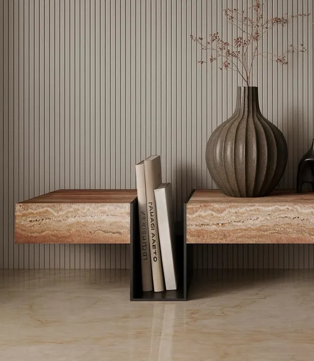 Marble side table with a candle and design books beside a bouclé sofa